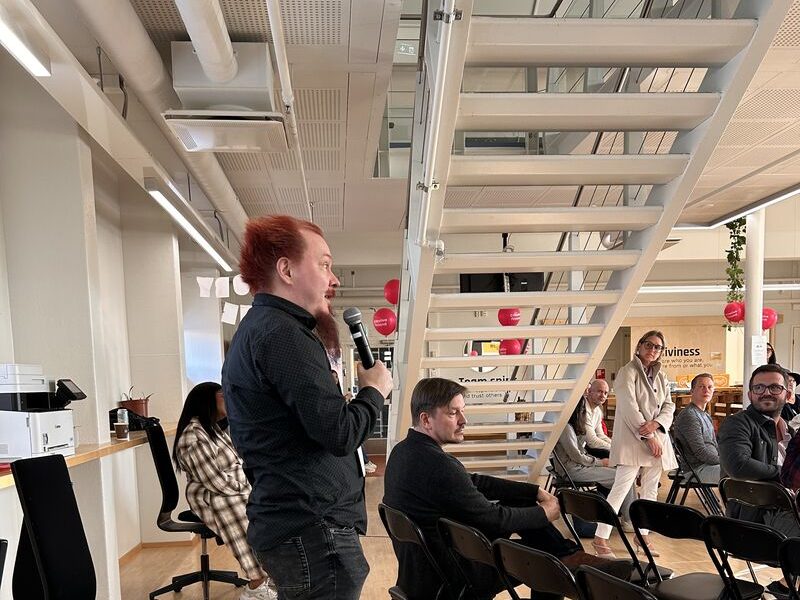 Jussi Autio giving a talk